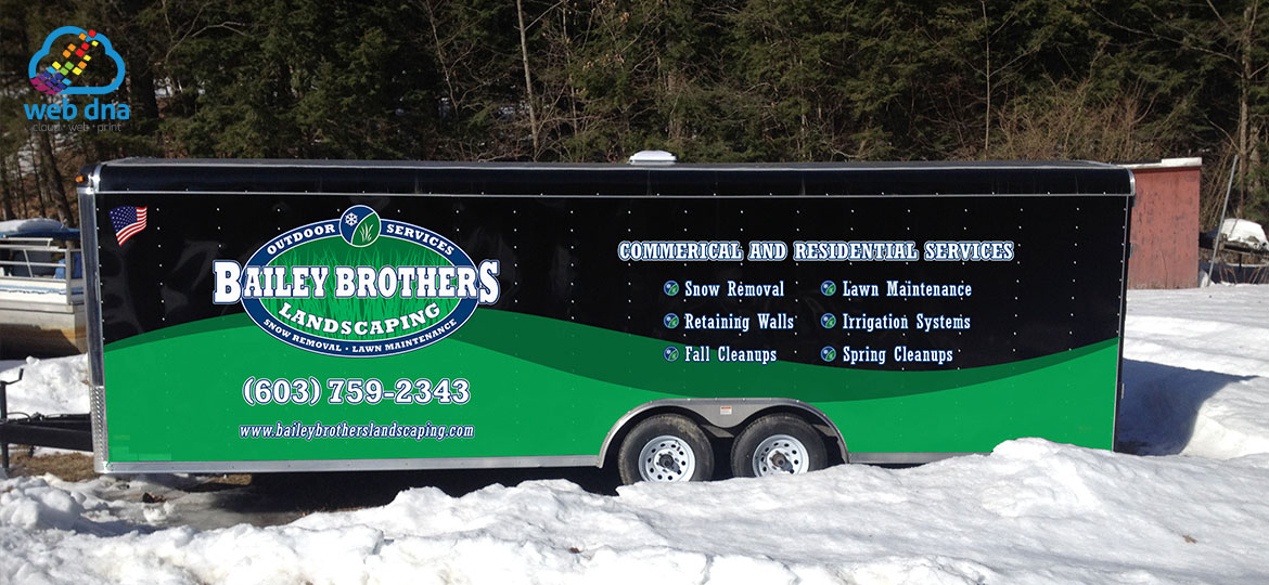 Utility trailer with landscaping company graphic designed by Web DNA applied to it.